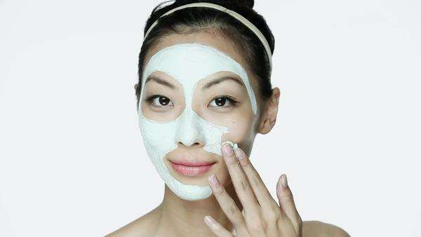 Image result for young woman putting on face mask