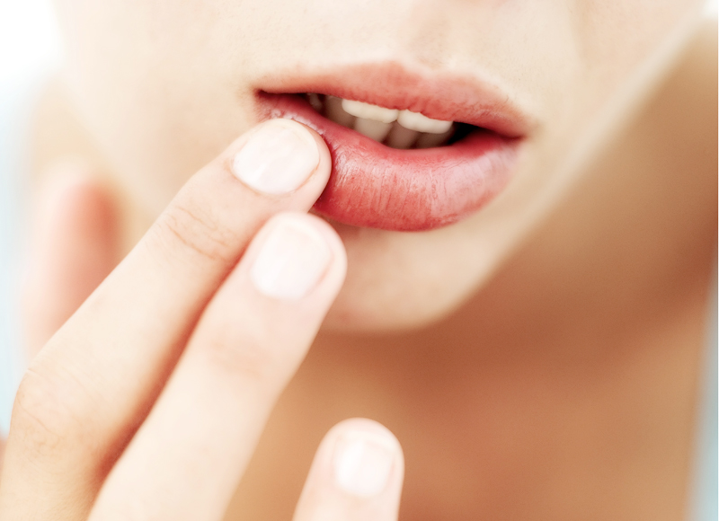 Image result for girl putting on lipbalm